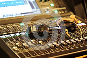 Professional audio Mixer and Professional Headphones in the Recording Studio. Sound Mixing Desk. Sound Mastering For Radio and TV