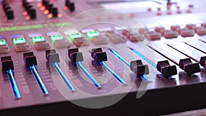 Professional audio mixing console closeup. Music studio.