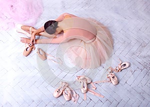 Professional ballet dancer resting after the performance.