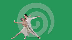 Professional ballet pair practicing moves on green screen. Gracefulness and tenderness in every movement.