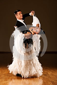 Professional ballroom dance couple preform an exhibition dance