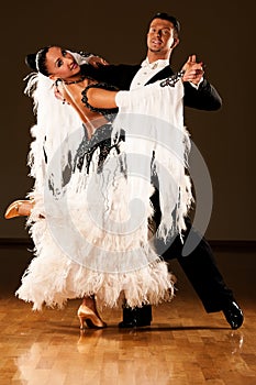 Professional ballroom dance couple preform an exhibition dance