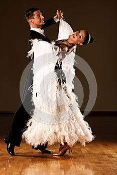 Professional ballroom dance couple preform an exhibition dance