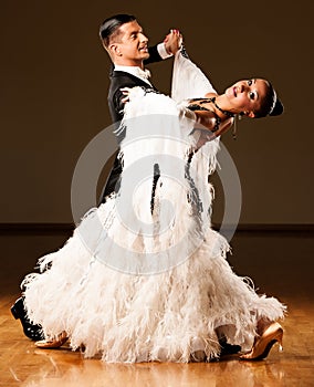 Professional ballroom dance couple preform an exhibition dance