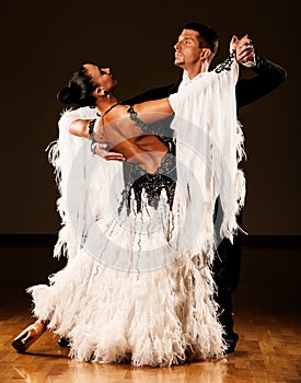 Professional ballroom dance couple preform an exhibition dance