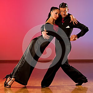 Professional ballroom dance couple preform an exhibition dance