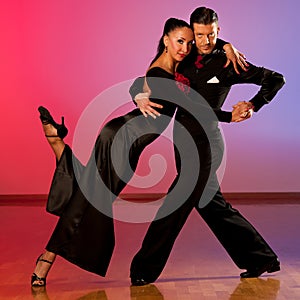 Professional ballroom dance couple preform an exhibition dance