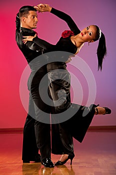 Professional ballroom dance couple preform an exhibition dance