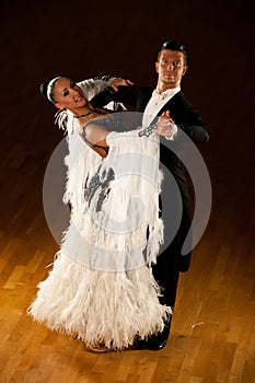 Professional ballroom dance couple preform an exhibition dance