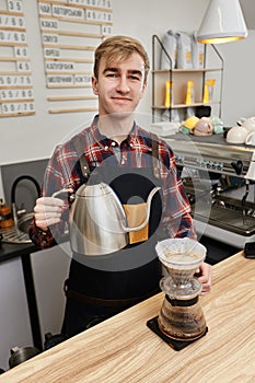 Professional barista man making coffee using filter