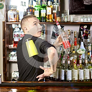 Professional barmen making cocktail