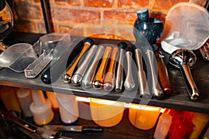 Professional bartender equipment called muddler or bar stunting photo