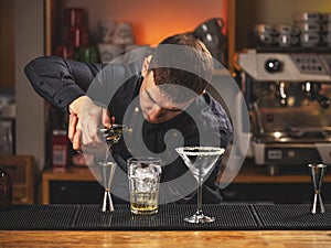 Professional bartender squeeze lime juice