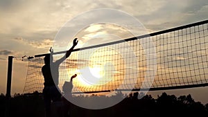 Professional Beach Volleyball at Sunset in Slow Motion.