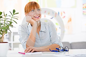 Professional beautiful young woman sitting her desk at her home