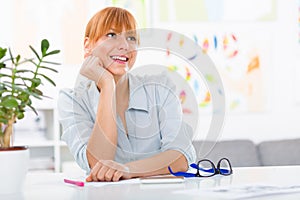 Professional beautiful young woman sitting her desk at her home