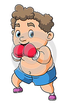 The professional big boy is doing the boxing the boxing gloves