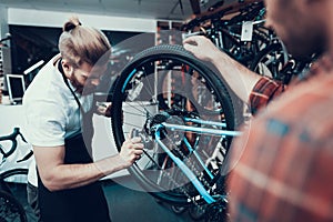 Professional Bike Repairman Fix Cycle in Workshop