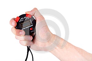 Professional black red sports digital stopwatch in hand, finger pressing the start button, man holding up a simple electronic