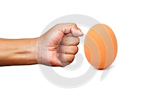 Professional box fight and dieting concept. Hand fist and brown egg isolated on white background