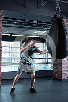 Professional boxer spending his time in gym before hitfest