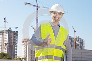 Professional builder holding a computer