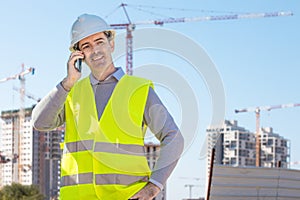 Professional builder standing talking on a phone