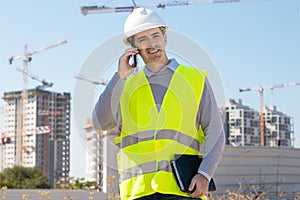 Professional builder standing talking on a phone