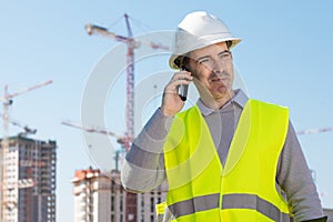 Professional builder standing talking on a phone