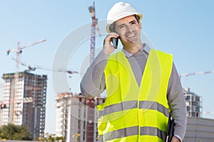 Professional builder standing talking on a phone