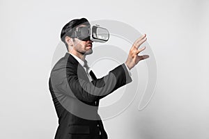 Professional business man holding something while wearing VR glass. Deviation.