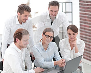 Professional business team sitting at the Desk in the office