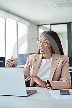 Professional business woman manager working in office having virtual meeting.