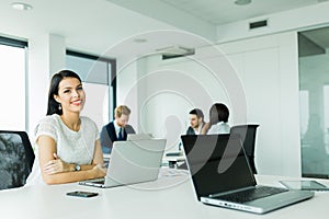 Professional businesswoman sitting at an office desk