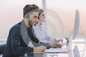 Professional call center operators communicate with customers.