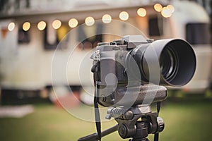 Professional camera put on tripod