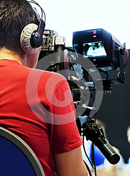 Professional cameraman with headphones