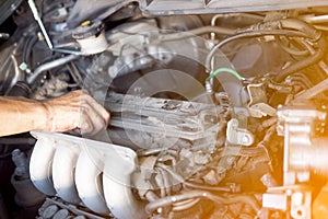 Professional car mechanic working in auto repair service