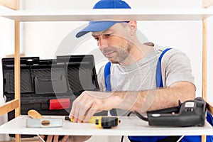 Professional Carpenter Making Furniture Unpacking Tools Before Work Indoor