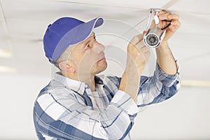 professional cctv technician installing camera