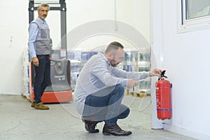 professional checking fire extinguisher