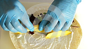 Professional chef`s hands filling ingredients wheat cake