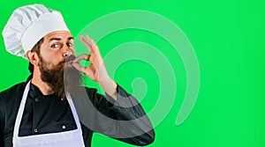 Professional chef showing delicious sign. Bearded cook or baker gesturing excellent. Perfect sign. Taste approval