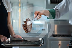 Professional chef who specializes in fine meats The steak that is served to the customer