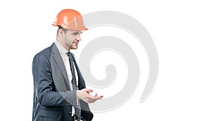 Professional civil engineer in hardhat and suit gesticulating, engineering
