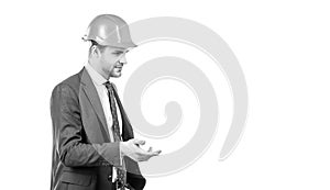 Professional civil engineer in hardhat and suit gesticulating, engineering