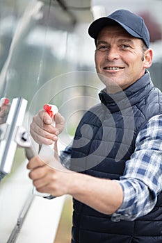 professional cleaner cleaning windows