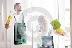 Professional cleaners cleaning windows photo