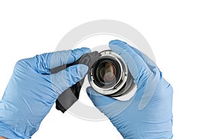 Professional cleaning of a camera housing with a cleaning cloth and gloves