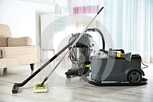 Professional cleaning equipment on floor indoors